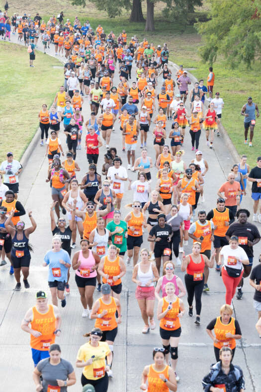 Too Hot To Handle overhead crowd picture of runners starting race