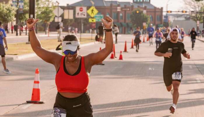 Big Texas Run participant crossing finish line