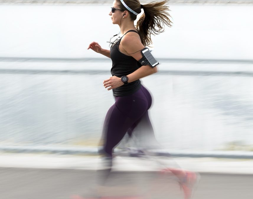 woman running wearing armband
